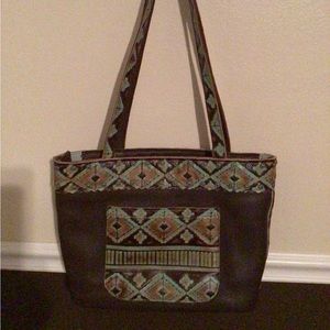Leather purse with dark brown cowhair.